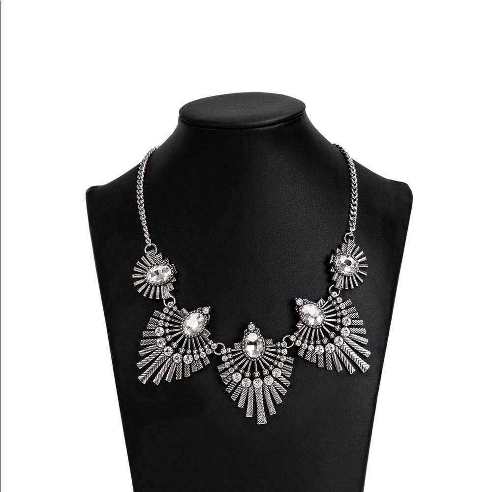 Silver sunburst Statement Necklace and earrings.